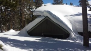 A Garage Entrance of a House Buried in Snow