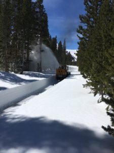 an excavator Clearing snow on the VL Rd.