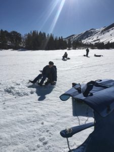 Fishermen Dave, Chris and Jay watching over their ice holes