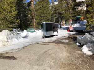 view of a cart with trees and snow around it