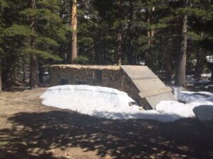 Gas pump house surrounded by snow