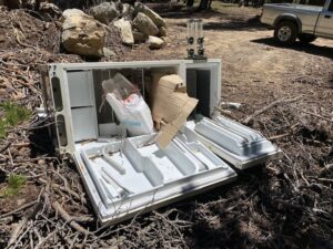 Dumped refrigerator at gravel pit