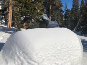 Snow buried solar panels on pole