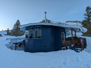 View of the Valchev cabin and snow around it