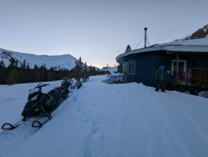 a kid standing next to the Valchev cabin