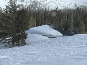 Backside of Yurt on Tip Top covered with snow