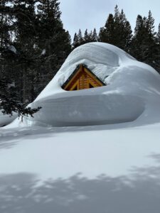 Cabin on Tamarack Covered with Snow