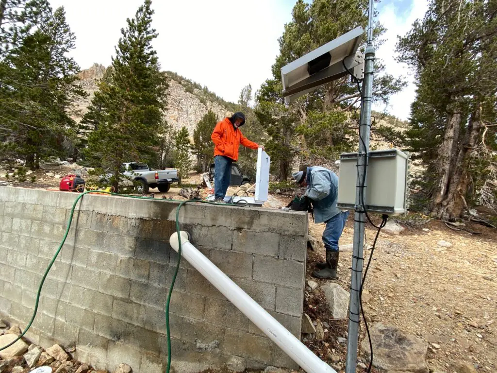 men working at the low tank