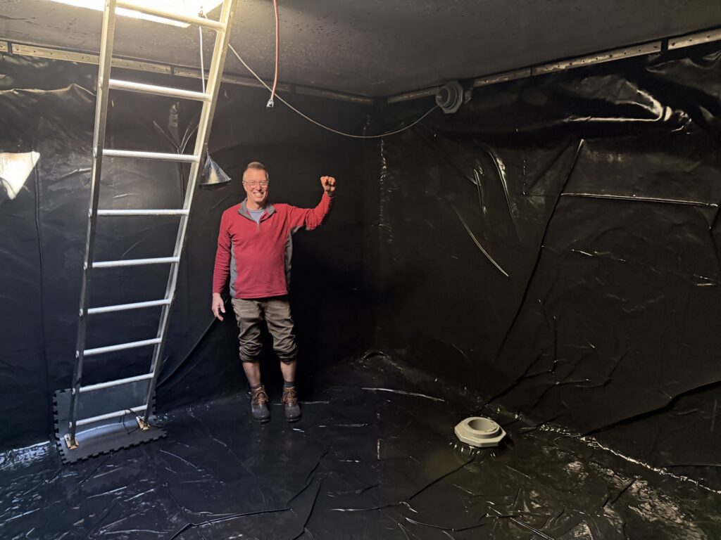 VP of the Board and Compliance Office, Chris Rinaldi finishing the cleaning of the Low Tank.